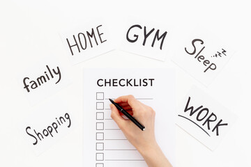 Hand writes in Checklist and many paper cards with hand drawing of different life activities, top...