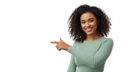 Young, confident mixed-race woman in light green top, dark curly hair, smiling and pointing left into transparent studio space, eye-level medium shot. Concept of clear guidance and future direction