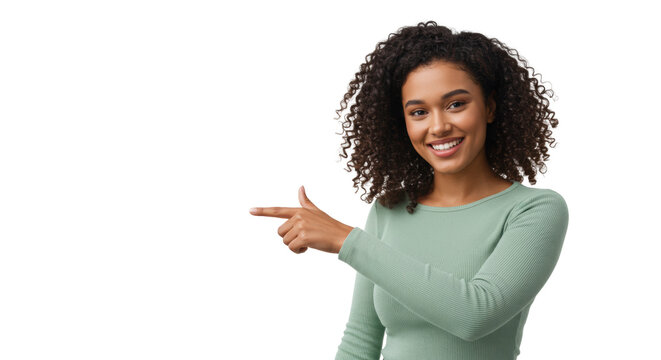 Young, confident mixed-race woman in light green top, dark curly hair, smiling and pointing left into transparent studio space, eye-level medium shot. Concept of clear guidance and future direction