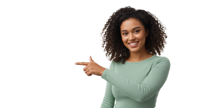 Young, confident mixed-race woman in light green top, dark curly hair, smiling and pointing left into transparent studio space, eye-level medium shot. Concept of clear guidance and future direction