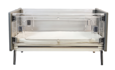 Empty hospital crib with clear sides