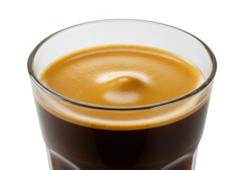 Closeup of a freshly brewed espresso in a clear glass, isolated on a transparent background, showcasing its rich crema and dark liquid