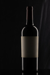 Bottle of wine on black background