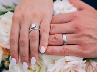 hands of the groom and the bride