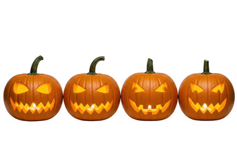 Fototapeta premium Four carved halloween pumpkins with glowing faces, isolated on transparent background