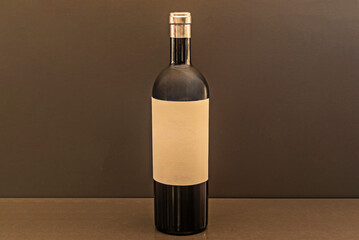 Wine bottle with an interesting light effect passing through its dense ruby contents.