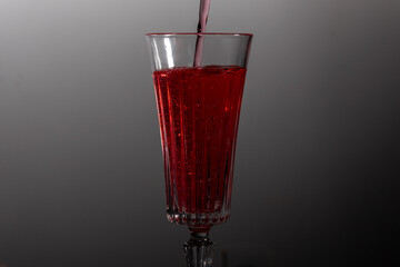 Glass filled with golden liquid