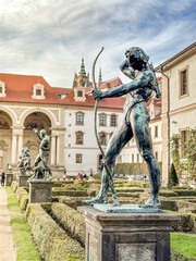 Classical bronze sculpture of an archer in the garden. Prague.