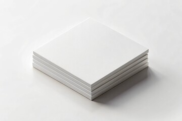 Stack of square white blank cards on a white surface