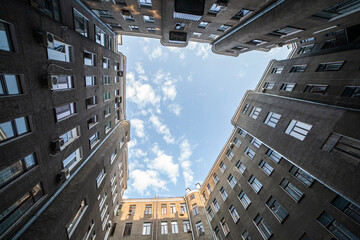 Courtyard view of old brick building with open sky above