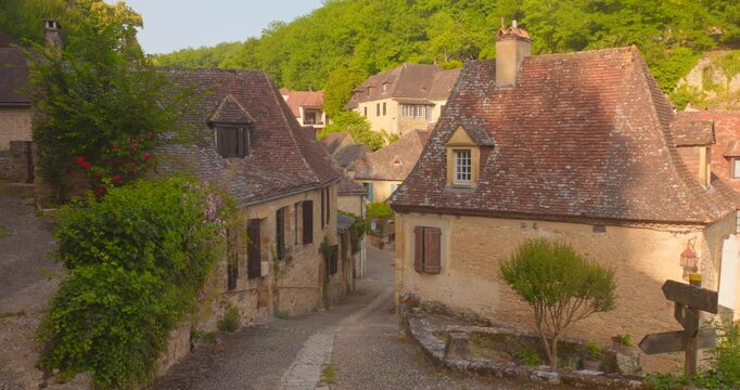 Medieval Houses Along The Narrow Street In Beynac, France. - wide shot