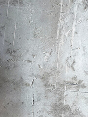 Fototapeta premium Gray cement surface with visible texture, design background, texture or construction visuals