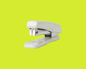 stapler isolated on green background