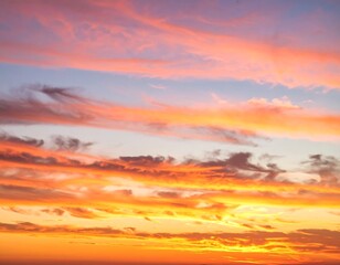 Obraz premium Vivid sunset hues paint the sky with layers of colorful clouds