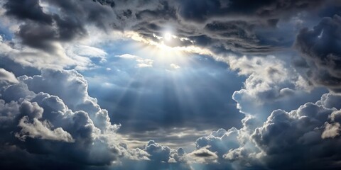 grey clouds in the sky with sun peeking through gaps