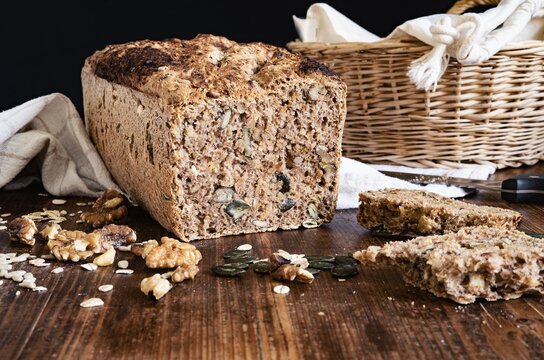 Rustic Spelt Bread with Walnuts and Carrots on wooden table