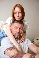 Portrait of a couple reflecting strong emotions in a comfortable environment