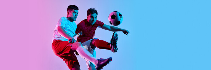 Two soccer players in fierce mid-air battle for ball. Concept of determination, rivalry, and peak competition for sports ads, team branding, and competitive athletic promotions. Banner