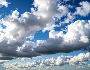 Vivid blue sky densely populated with fluffy cumulus clouds