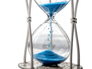 Close up of a vintage hourglass with bright blue sand falling against a black background