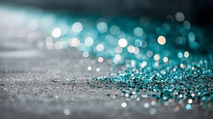 Closeup of shimmering deep blue particles and bokeh light spots on dark background with glittering crystal reflections and outoffocus glow, space for text