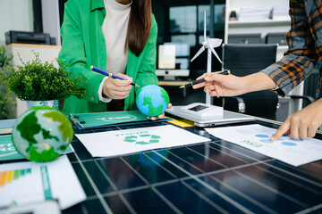 business team people planning and discussing on recycle reduce reuse policy symbol in office meeting room. Green business company and Solar Energy Environment