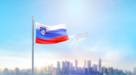 Slovenia national flag waving with skyline and buildings. Slovenia national flag for independence...