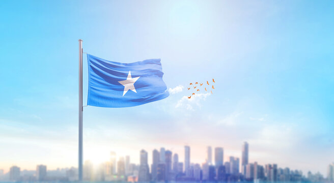 Somalia national flag waving with skyline and buildings. Somalia national flag for independence day.