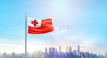 Tonga national flag waving with skyline and buildings. Tonga national flag for independence day.