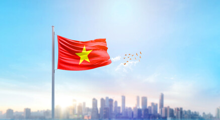 Vietnam national flag waving with skyline and buildings. Vietnam national flag for independence day.