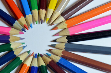 Colored pencils circle. An overhead shot of a circle of various colored pencils with sharpened tips...