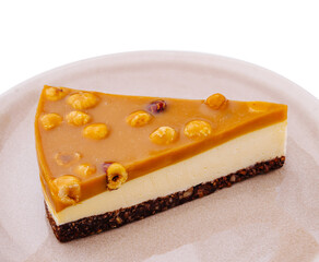 Delicious dessert slice with caramel topping and crunchy texture on plate