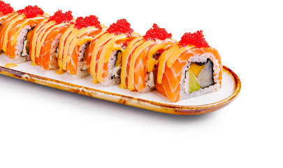 Sushi roll with salmon, avocado, and spicy mayo served on a plate