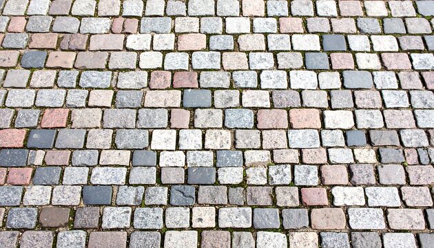 Old town pavement made of cobblestones in varying colors and texture - Powered by Adobe