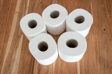 Papier rolls for toilet room on the wood background.
