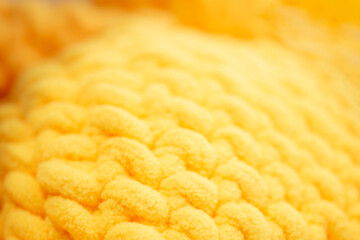 Close up of yellow plush yarn texture pattern