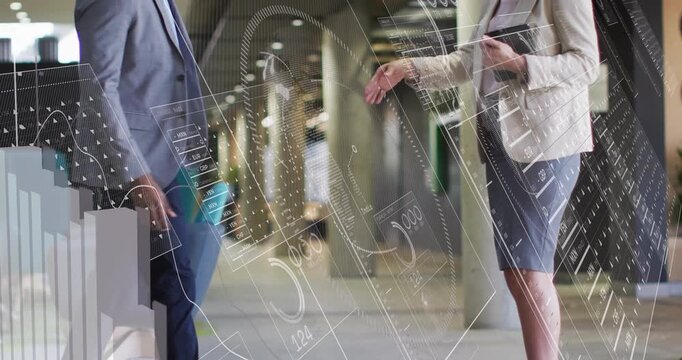 Man entering lobby with briefcase and woman holding tablet shaking hands over business charts
