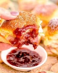 Deliciously sugared ham and cheese slider with raspberry jam drizzle