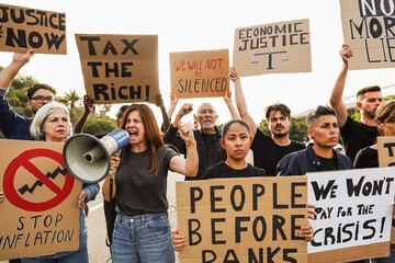 Crowd of multiracial people protest against inflation and financial crisis - Protesters marching...
