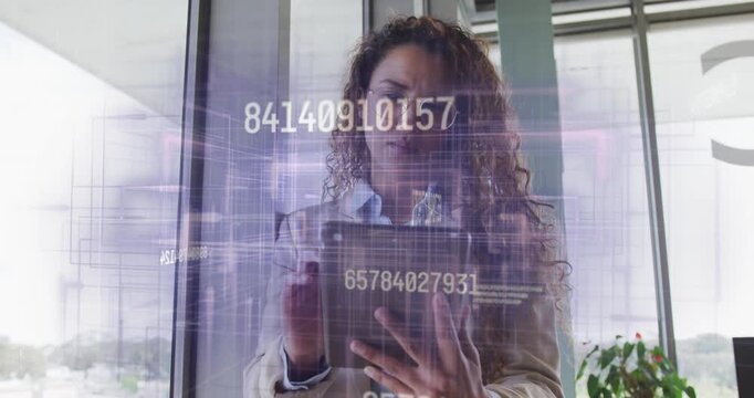 Businesswoman tapping tablet and reviewing floating numeric overlays while scrolling data sets