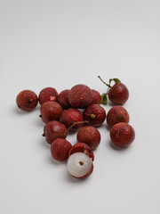 A bunch of lychees on white background