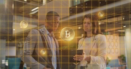 Woman tapping tablet launching blockchain grid in office while colleague analyzing Bitcoin icons - Powered by Adobe