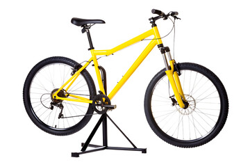 Obraz premium Yellow mountain bicycle on repair stand isolated on a transparent background yellow bicycle