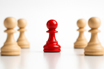 A red figurine separated from two natural figurines symbolizing division or confrontation