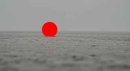 Minimalist red circle on grey surface