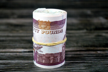 50 EGP Egypt money roll pounds, 50 LE fifty Egyptian pounds cash money bills rolled up with rubber...