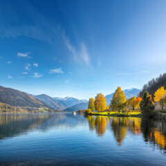 Remarkable autumn view of lake and trees in city park of Sell Am See