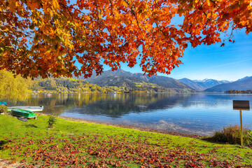 Amazing autumn view of lake and trees in city park of Sell Am See