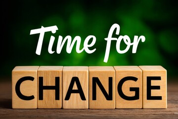 Wooden cubes showing time for change on blurred green background