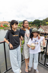 Family Touring Bridge Over River Kwai, Thailand
